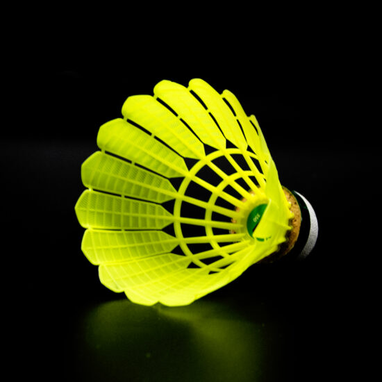 Yellow nylon badminton shuttlecock similar to Mavis 350 for training use