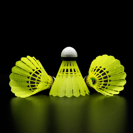 Yellow nylon badminton shuttlecock similar to Mavis 350 for training use