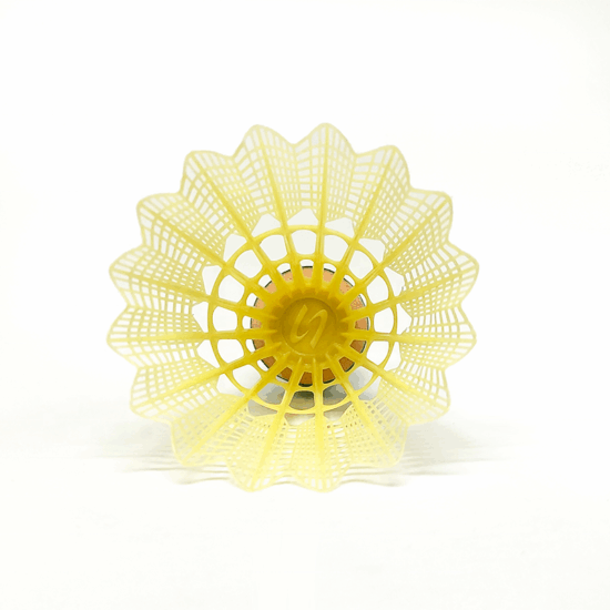 Yellow plastic badminton shuttlecocks with leaf-style skirt