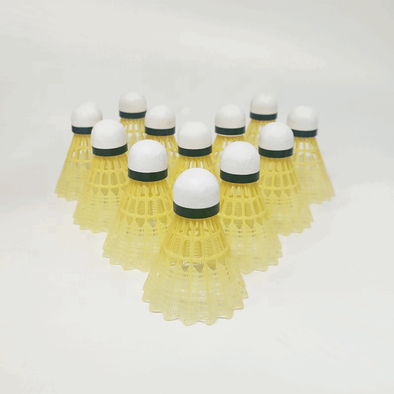 Yellow plastic badminton shuttlecocks with leaf-style skirt