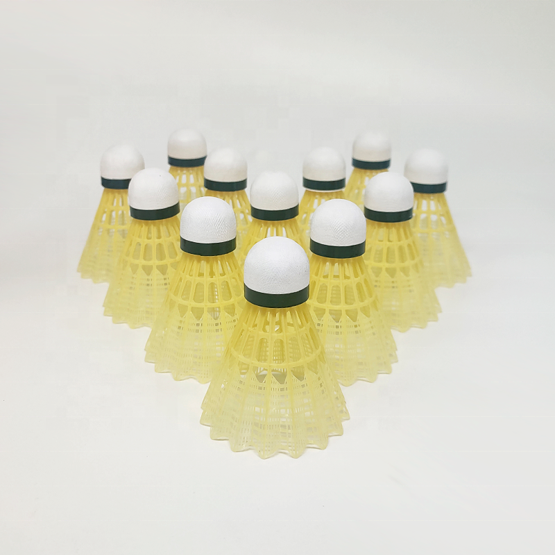 Yellow plastic badminton shuttlecocks with leaf-style skirt